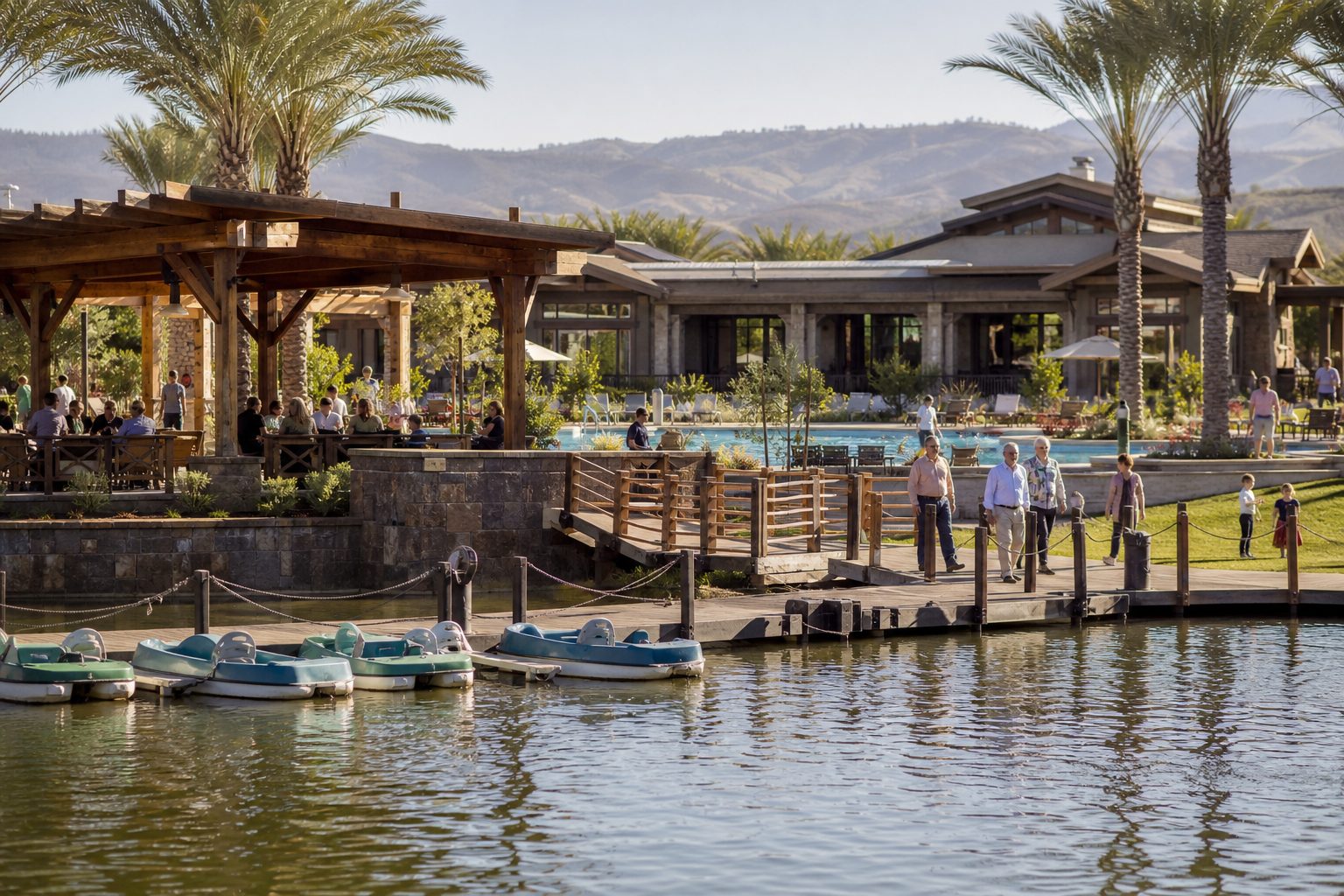 Private Lake Club resort pool and waterfront pavilion in Bridgeport Valencia with families enjoying amenities, paddle boats, and manicured lakeside